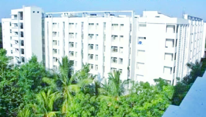 Kanchanaganga Hostel building with lush greenery around